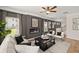 Spacious living room with an electric fireplace, cozy seating, and plenty of natural light at 106 Jacobs Farm Ln # 42, Lawrenceville, GA 30045
