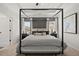 Luxurious main bedroom with a tray ceiling, a canopy bed, and tasteful furnishings at 106 Jacobs Farm Ln # 42, Lawrenceville, GA 30045