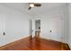 Empty bedroom featuring hardwood floors, white walls, and two doors for ample closet space at 1228 Hosea L Williams Ne Dr, Atlanta, GA 30317