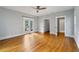 Expansive bedroom with gleaming hardwood floors, bathed in natural light, complemented by French doors at 1228 Hosea L Williams Ne Dr, Atlanta, GA 30317