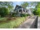 A charming two-story home is nestled on a beautifully landscaped lot with a stone driveway at 1228 Hosea L Williams Ne Dr, Atlanta, GA 30317