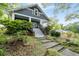 Charming two-story home features a welcoming front porch and landscaped front yard at 1228 Hosea L Williams Ne Dr, Atlanta, GA 30317