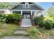 Charming two-story home features a welcoming front porch and landscaped front yard at 1228 Hosea L Williams Ne Dr, Atlanta, GA 30317
