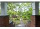 Enjoy the view from the charming front porch with brick columns and concrete steps at 1228 Hosea L Williams Ne Dr, Atlanta, GA 30317