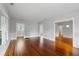 Bright living room featuring beautiful hardwood floors and neutral paint at 1228 Hosea L Williams Ne Dr, Atlanta, GA 30317
