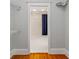 View through walk-in closet to bathroom with white floors and dark shower curtain at 1228 Hosea L Williams Ne Dr, Atlanta, GA 30317