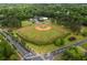 Aerial view of community baseball field surrounded by trees and roads at 1614 Rucker Rd, Alpharetta, GA 30009