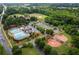 Aerial view of community park with a pool, ball fields, and trees at 1614 Rucker Rd, Alpharetta, GA 30009