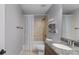 Bathroom featuring granite countertop, shower/tub combo with tiled walls and a privacy curtain at 1614 Rucker Rd, Alpharetta, GA 30009