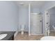 Bathroom featuring a toilet, glass door shower, and vanity, all designed for modern convenience at 1614 Rucker Rd, Alpharetta, GA 30009