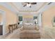 Lovely bedroom features a tray ceiling, neutral carpet and a large window at 1614 Rucker Rd, Alpharetta, GA 30009