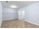 An airy bedroom with neutral paint, durable tile flooring, and generous closet space for ample storage solutions at 1614 Rucker Rd, Alpharetta, GA 30009