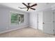 Bedroom with carpeted floors, window and door at 1614 Rucker Rd, Alpharetta, GA 30009