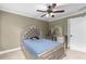 Comfortable bedroom features natural light and a ceiling fan at 1614 Rucker Rd, Alpharetta, GA 30009