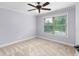 Bedroom with carpeted floors and window at 1614 Rucker Rd, Alpharetta, GA 30009