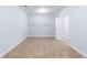 Large walk-in closet offers ample storage space with shelving and a convenient door at 1614 Rucker Rd, Alpharetta, GA 30009