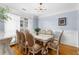Charming dining room with hardwood floors, decorative moldings, and natural light creating a warm, inviting atmosphere at 1614 Rucker Rd, Alpharetta, GA 30009