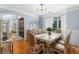Elegant dining room featuring hardwood floors, detailed molding, and large windows providing ample natural light at 1614 Rucker Rd, Alpharetta, GA 30009