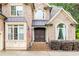 Close-up view of the front entrance, highlighting brickwork and double doors at 1614 Rucker Rd, Alpharetta, GA 30009