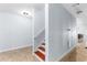 Hallway with tile floor, staircase and modern lighting at 1614 Rucker Rd, Alpharetta, GA 30009