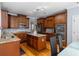Spacious kitchen featuring granite countertops, a central island, stainless steel appliances, and ample cabinet space at 1614 Rucker Rd, Alpharetta, GA 30009
