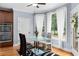 Bright eat-in kitchen features stainless appliances and view to backyard at 1614 Rucker Rd, Alpharetta, GA 30009