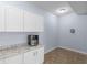 View of Kitchenette, featuring white cabinets and granite countertops at 1614 Rucker Rd, Alpharetta, GA 30009