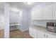 Modern kitchenette features granite countertops and stainless steel appliances at 1614 Rucker Rd, Alpharetta, GA 30009