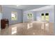 Bright living room with tile floors, piano, and exterior access at 1614 Rucker Rd, Alpharetta, GA 30009