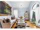 Comfortable living room featuring elegant furniture, hardwood floors, large windows, and stylish decor at 1614 Rucker Rd, Alpharetta, GA 30009