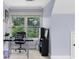 This office features a black desk and chair with a window view at 1614 Rucker Rd, Alpharetta, GA 30009