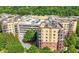 Aerial view of multi-story condo buildings with rooftop parking, offering convenience and residential charm at 200 River Vista Dr # 120, Atlanta, GA 30339