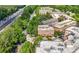 Aerial view of a brick condo building, showcasing its architecture and proximity to surrounding trees at 200 River Vista Dr # 120, Atlanta, GA 30339