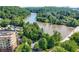 Scenic aerial shot of riverfront condo community surrounded by dense green trees at 200 River Vista Dr # 120, Atlanta, GA 30339
