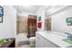Bathroom featuring a shower-tub combination, a toilet, and a single sink vanity with modern fixtures at 200 River Vista Dr # 120, Atlanta, GA 30339