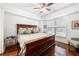 Comfortable bedroom with a ceiling fan, hardwood floors, and a large window at 200 River Vista Dr # 120, Atlanta, GA 30339