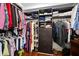 Walk-in closet with custom shelving and ample storage space for clothes and accessories at 200 River Vista Dr # 120, Atlanta, GA 30339