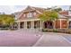 Beautiful clubhouse with classic architectural details and brick walkway at 200 River Vista Dr # 120, Atlanta, GA 30339