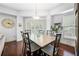 Elegant dining area with stylish lighting, a large table, and natural light from the window at 200 River Vista Dr # 120, Atlanta, GA 30339