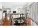 Bright dining room featuring hardwood floors, large table and chairs, and sliding glass doors at 200 River Vista Dr # 120, Atlanta, GA 30339