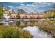 Charming townhomes reflected on a scenic pond with a fountain and lush landscaping at 200 River Vista Dr # 120, Atlanta, GA 30339