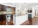Well-appointed kitchen with stainless steel appliances, granite countertops, and dark wood cabinetry at 200 River Vista Dr # 120, Atlanta, GA 30339