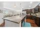 Modern kitchen with stainless steel appliances and granite countertops, open to the living area at 200 River Vista Dr # 120, Atlanta, GA 30339