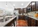Modern kitchen with stainless steel appliances, granite countertops, and hardwood floors at 200 River Vista Dr # 120, Atlanta, GA 30339