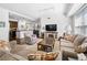 Open-concept living space with a modern kitchen, neutral color palette, and hardwood flooring at 200 River Vista Dr # 120, Atlanta, GA 30339