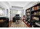 Bright office space includes a desk, computer, chair, built-in shelving, and stylish decor at 200 River Vista Dr # 120, Atlanta, GA 30339
