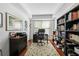 Home office featuring a desk, computer, bookshelves, hardwood floors, and a floral rug at 200 River Vista Dr # 120, Atlanta, GA 30339