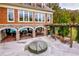 An outdoor seating area with brick accents, a pergola, and comfortable furniture overlooking the pool at 200 River Vista Dr # 120, Atlanta, GA 30339