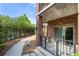 Covered patio with a brick wall, walkway, and landscaping; perfect for outdoor relaxation at 200 River Vista Dr # 120, Atlanta, GA 30339