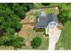 Aerial view of a well-maintained home with a spacious, fenced backyard and lush greenery at 259 Pine Valley Dr, Powder Springs, GA 30127